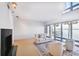 Bright living room with a fireplace and large windows overlooking the water, with views of palm trees at 4950 Bayshore Blvd # 23, Tampa, FL 33611