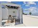 Charming rooftop patio with dining set and decor, enhanced by bay views at 4950 Bayshore Blvd # 23, Tampa, FL 33611