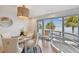 Elegant dining area with water views and modern light fixture at 4950 Bayshore Blvd # 23, Tampa, FL 33611