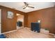 Simple bedroom with wood floors and mirrored closet doors at 7022 Arbor View Ln, New Port Richey, FL 34653