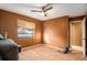 Simple bedroom with wood floors and a window at 7022 Arbor View Ln, New Port Richey, FL 34653