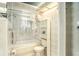 Clean bathroom with a bathtub, toilet and shower at 7022 Arbor View Ln, New Port Richey, FL 34653