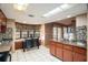 Modern kitchen with breakfast nook and stainless steel appliances at 7022 Arbor View Ln, New Port Richey, FL 34653