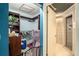 Closet and bathroom with shower stall at 7022 Arbor View Ln, New Port Richey, FL 34653