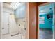 Small laundry room with a sink and cabinets at 7022 Arbor View Ln, New Port Richey, FL 34653