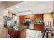 Modern kitchen with stainless steel appliances and wood cabinets at 7022 Arbor View Ln, New Port Richey, FL 34653