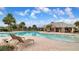 Resort-style pool with lounge chairs and a playground nearby at 11650 Cambium Crown Dr, Riverview, FL 33569