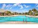 Resort-style pool with a clubhouse and lounge chairs at 11650 Cambium Crown Dr, Riverview, FL 33569