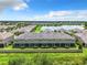 Aerial view of townhouses near a lake at 11650 Cambium Crown Dr, Riverview, FL 33569