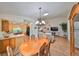 Spacious dining area with a view into the kitchen and living room at 736 Mccallister Ave, Sun City Center, FL 33573