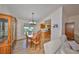 Charming dining room with wood table and chairs, and kitchen access at 736 Mccallister Ave, Sun City Center, FL 33573