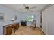 Home office with built-in shelves and a desk at 736 Mccallister Ave, Sun City Center, FL 33573
