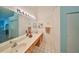 Bathroom with double vanity and light blue walls at 736 Mccallister Ave, Sun City Center, FL 33573