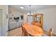 Bright dining area with hardwood floors and a view of the living room at 736 Mccallister Ave, Sun City Center, FL 33573