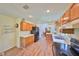 Bright kitchen with wood cabinets and light flooring at 736 Mccallister Ave, Sun City Center, FL 33573