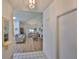 Entryway with a view into the living room with wood flooring at 736 Mccallister Ave, Sun City Center, FL 33573