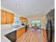 Kitchen boasts wood cabinets, stainless steel appliances, and adjacent breakfast area at 736 Mccallister Ave, Sun City Center, FL 33573
