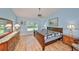 Spacious Primary bedroom with large bed and dresser at 736 Mccallister Ave, Sun City Center, FL 33573
