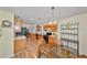Open kitchen with wood cabinets, breakfast nook, and views to living areas at 736 Mccallister Ave, Sun City Center, FL 33573