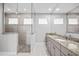Large bathroom with walk-in shower and granite double vanity at 5217 Forbes Ter, Port Charlotte, FL 33981
