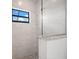 Modern bathroom with a glass-enclosed shower featuring granite seating and tile at 5217 Forbes Ter, Port Charlotte, FL 33981