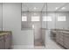 Bathroom with granite countertops, tiled floors, and a seamless glass shower at 5217 Forbes Ter, Port Charlotte, FL 33981