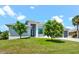Two-story house with gray roof and landscaping at 5217 Forbes Ter, Port Charlotte, FL 33981