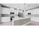 Modern kitchen with white cabinets and island at 5217 Forbes Ter, Port Charlotte, FL 33981