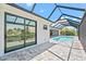 Relaxing pool area with covered patio and water view at 5217 Forbes Ter, Port Charlotte, FL 33981