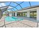 The screened-in lanai features a pool, patio, and seamless access to the interior at 5217 Forbes Ter, Port Charlotte, FL 33981