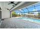 A screened-in lanai features a beautiful pool with a waterfront view and seamless indoor-outdoor living at 5217 Forbes Ter, Port Charlotte, FL 33981