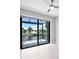 Bedroom with sliding doors that open to stunning waterfront views at 5217 Forbes Ter, Port Charlotte, FL 33981