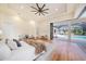 Spacious main bedroom with wood floors and a seamless transition to the outdoor pool area at 9276 Starry Night Ave, Sarasota, FL 34241