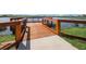 Wooden fishing dock extending over the lake at 9276 Starry Night Ave, Sarasota, FL 34241