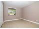 Simple bedroom with light walls and wood-look flooring at 210 Red Cedar Pl, Brandon, FL 33510