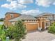 Two-story house with a two-car garage, and a nicely landscaped yard, next to a lake at 12818 Boggy Creek Dr, Riverview, FL 33579