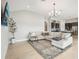 Living room with sectional sofa, rug, and coffee table at 12818 Boggy Creek Dr, Riverview, FL 33579