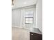 Charming bedroom with white curtains, tile floors, and a ceiling fan at 12818 Boggy Creek Dr, Riverview, FL 33579