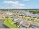 Aerial view of community with lake and homes at 12818 Boggy Creek Dr, Riverview, FL 33579
