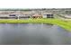 Aerial view of lakefront homes with pools at 12818 Boggy Creek Dr, Riverview, FL 33579