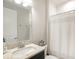 Simple bathroom with single vanity, shower/tub combo, and neutral decor at 12818 Boggy Creek Dr, Riverview, FL 33579