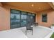 Covered patio with sliding glass doors and lake view at 12818 Boggy Creek Dr, Riverview, FL 33579