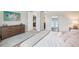 Bedroom with a queen-size bed, dresser, and mirror reflecting a water view at 12818 Boggy Creek Dr, Riverview, FL 33579