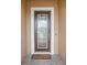 Modern front door with glass panels and a welcome mat at 12818 Boggy Creek Dr, Riverview, FL 33579