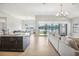 Open floor plan with a large island kitchen and spacious living area with lake views at 12818 Boggy Creek Dr, Riverview, FL 33579