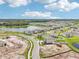 Aerial view of houses, lake and landscape at 12818 Boggy Creek Dr, Riverview, FL 33579