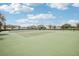 Community tennis courts with seating and fencing at 12818 Boggy Creek Dr, Riverview, FL 33579