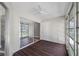 Sunroom with sliding glass doors and wood flooring at 1655 S Highland Ave # E223, Clearwater, FL 33756