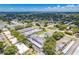 Aerial view of community, showcasing building exteriors and pool at 1655 S Highland Ave # E223, Clearwater, FL 33756