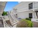 Exterior view of building, showing stairs and landscaping at 1655 S Highland Ave # E223, Clearwater, FL 33756